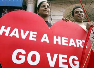 Animal rights activists of the People for the Ethnic Treatment of Animals hold a placard