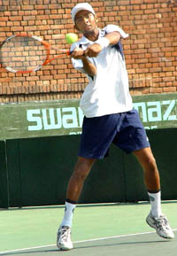 Jeevan Nedunchezhiyan returns the ball to Rupesh Roy during their semifinal match at the ITF Juniors tennis tournament at CLTA courts, Sector 10