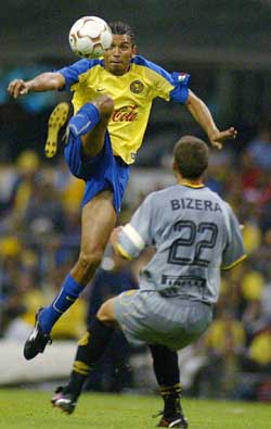 Frankie Oviedo of America leaps for the ball over Emmerson Bizera