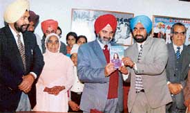 Vice-Chancellor of Punjab Agricultural University K.S. Aulakh releases the biography of Kalpana Chawla by Gurdeep Pandher