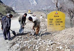 Work on progress to widen the Srinagar-Muzzafarabad road near Uri on Saturday.