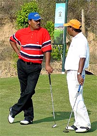 Vijay Kumar and Pappan await their turn at the Forest Hill Golf Open in Chandigarh 
