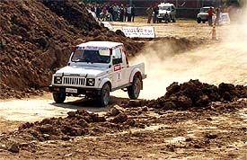 A driver competes in the Maruti Suzuki