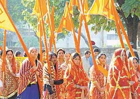 Devotees participate in a Shobha yatra taken out in connection with Maha Shivratri in Chandigarh