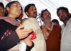 Family members of Anshul talk to mediapersons outside a police station in Ambala 