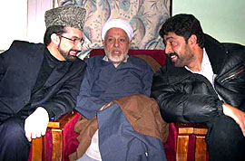 Hurriyat Chairman Moulana Mohammad Abbas Ansari shares some light moments with executive members Mirwaiz Moulvi Umer Farooq and Bilal Lone during a meeting of the separatist conglomerate in Srinagar on Monday