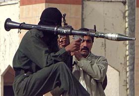 Iraqi policemen stand guard outside a police station in Falluja, 50-km west of Baghdad 