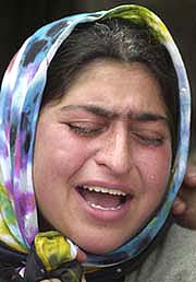 A relative mourns the death of Abdul Rashid Bhat after he was killed in Narbal, 18-km north of Srinagar, on Tuesday