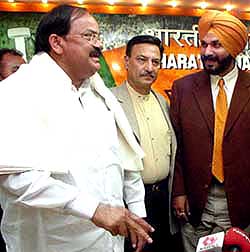 BJP President M. Venkaiah Naidu, Bollywood actor Suresh Oberoi and former Indian cricketer-turned-commentator Navjot Sidhu, who formally joined the BJP, at the party headquarters in the Capital 