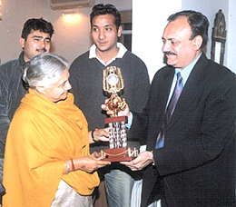 Delhi Chief Minister Sheila Dikshit being presented a memento by vice-chairman of the National Cricket Academy C K Khanna when he called on her.
