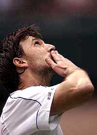 Croatian tennis star Goran Ivanisevic reacts during his match against Sjeng Schalken of The Netherlands at the ABN AMRO tennis tournament 