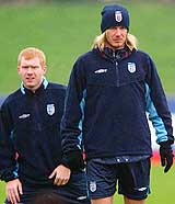 England captain David Beckham and teammate Paul Scholes take part in a training session at London Colney