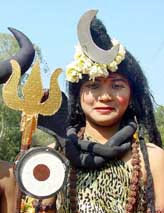 A girl dressed as Lord Siva during a procession on the occasion of Maha Shivratri in Bhopal