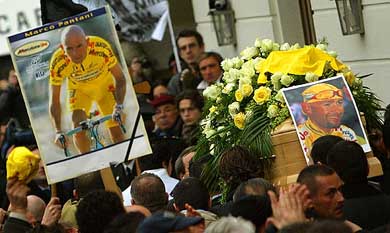 Crowds surge around the coffin of Italian cycling great Marco Pantani