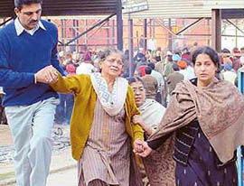 Wailing grandmother and mother of Vikas Mahajan at the Sector 25 cremation ground on Thursday in Chandigarh. 