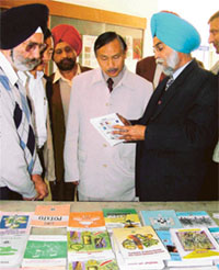 Senior officials of Punjab Agricultural University show various publications to Huska Sumi, Agriculture Minister of Nagaland
