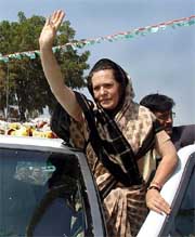 Congress President Sonia Gandhi waves to her supporters at Varanasi