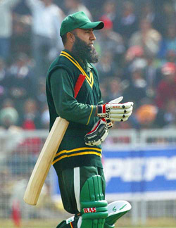 Pakistani veteran cricketer Saeed Anwar leaves the ground after being out for nought during a exhibition match in Patiala