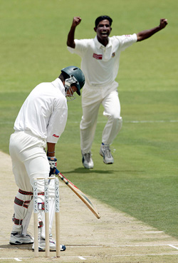 Zimbabwe opener Trevor Gripper looks down after being caught