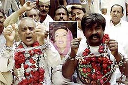 Activists of Pakistan's opposition Alliance for the Restoration of Democracy (ARD) protest against the detention of nuclear scientists