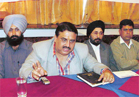 Mr Varinder Rakheja, general secretary of the Sewing Machine Dealers and Assemblers Association, addresses mediapersons