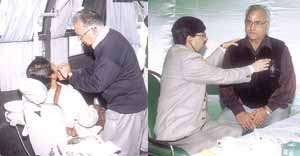 Dr J. L. Paul, dental practitioner, and Dr Dinesh Singh, Head, Department of Radiation Oncology, Dharamshila Cancer Hospital & Research Centre, examining patients at a health camp in the Capital.