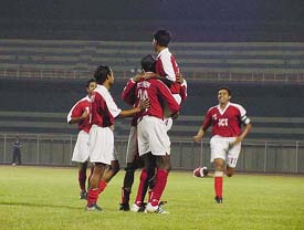 JCT players celebrate after a goal against Indian Bank during the National Football League match at Guru Nanak Stadium in Ludhiana 
