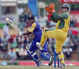 Sri Lankan batsman Sanath Jayasuriya steers the ball past Australian wicketkeeper Adam Gilchrist 