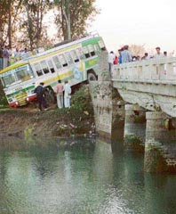 A PRTC bus positioned precariously on the Kaind Bridge in Dehlon on Monday