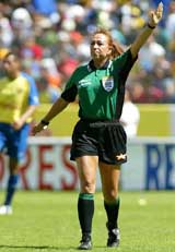 Virginia Tovar, the first female referee to officiate in Mexico's professional soccer league match, gestures in her debut match between Irapuato vs America 