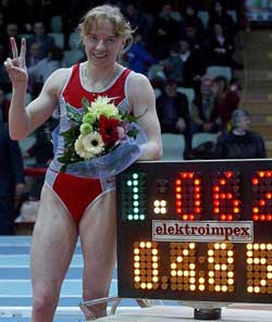 Russia's Svetlana Feofanova flashes a V sign after setting a new women's indoor pole vault record with a leap of 4.85 meters