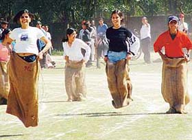 Girls of MCM DAV College, Sector 36, take part in sack race on the college campus in Chandigarh