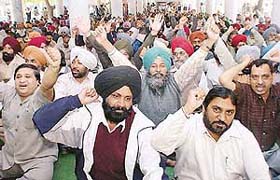 Members of the Punjab State Cooperative Board Corporation Mahasangh protest in support of their demands in Sector 17, Chandigarh
