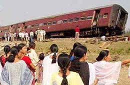 Villagers watch the rescue operation
