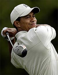 Tiger Woods hits a shot 