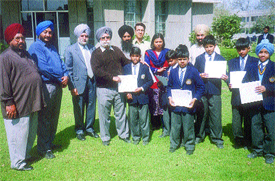 Some of the team members of the Guru Harkrishan Public School hockey team, Shahdara, who won the Inter-School Hockey Tournament for under-14, at a felicitation function on the school premises