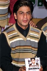 Bollywood star Shahrukh Khan poses for photographers during the music release of his new film Main Hoon Na
