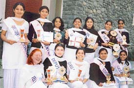 The prize winners of GCW proudly pose with their trophies at the annual prize distribution function held in the college