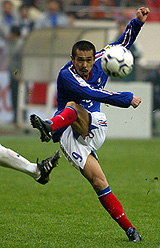 Tatsuhiko Kubo of Japan's Yokohama F. Marinos attempts a shot