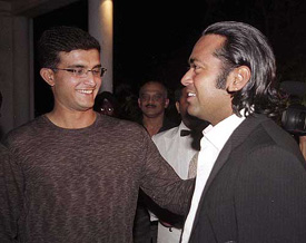 Indian cricket captain Sourav Ganguly having a word with tennis star Leander Paes