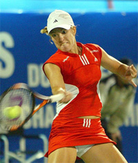 World number one and defending champion Justine Henin-Hardenne makes forehand return to US Meghann Shaughnessy