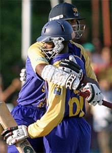 Sri Lanka�s Nuwan Zoysa and Russel Arnold celebrates their three-wicket victory over Australia in the fifth and final one-day international cricket match in Colombo