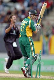 South Africa�s Boeta Dippenaar is bowled by New Zealand�s Chris Cairns during their 5th ODI match at Eden Park in Auckland