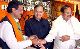 Ranjeet Singh Chautala with BJP President Venkaiah Naidu and Arun Jaitley