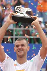 Kuerten, of Brazil, celebrates after defeating Aqustin Calleri, of Argentina, in the final game of the Brazil Open in Sauipe