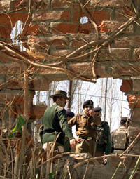 BSF personnel assess the damage after an explosion in Srinagar on Tuesday.