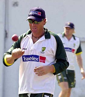 Australian bowler Shane Warne spins a ball during a training session 
