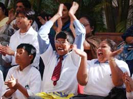 Mentally challenged children cheer in support of their school-mates