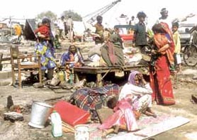 Shelterless after a blaze in a slum behind the thermal power plant near Rajghat.