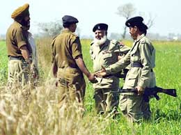 BSF personnel interact with Pakistani Rangers